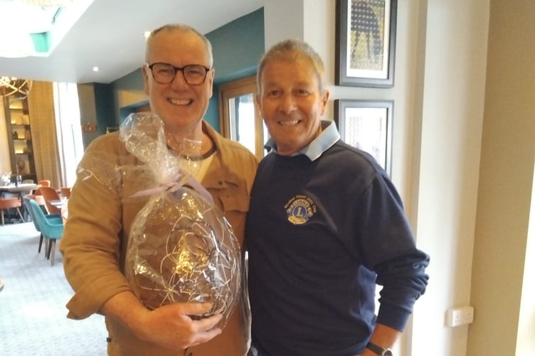 Easter egg winner Max Howard with Woolmer Forest Lions President John Lewis.